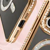 A close-up view of a gold iPhone case with diamond accents. Náhled obrázku produktu