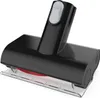 A close-up studio shot of a vacuum cleaner attachment, viewed from a slight angle. Voir les images du produit