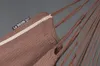 Close-up of a brown hammock or hanging chair with ropes. Produktbild-Vorschau