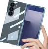 A hand is holding a blue foldable phone case with a transparent back showing a geometric pattern. Produktbild-Vorschau