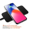A smartphone is placed on a black wireless charger, with a cable connected to the charger. Produktbild-Vorschau