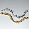 Two charm bracelets, one silver and one gold, are displayed against a white background. Podgląd zdjęcia produktu