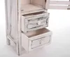 A close-up view of a white, distressed wooden cabinet with two open drawers. Produktbild-Vorschau