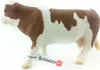 A toy cow figurine on a white background. Podgląd zdjęcia produktu