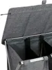 A close-up view of the top section of a grey, multi-compartment laundry hamper. Produktbild-Vorschau