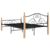 A black metal bed frame with wooden posts, shown against a white background. Produktbild-Vorschau