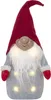 A festive gnome figure with a red hat and beard, illuminated by internal lights. Produktbild-Vorschau