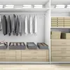 A closet interior with organized clothing and storage boxes. Produktbild-Vorschau
