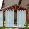 Outdoor curtains hanging from a wooden gazebo. Podgląd zdjęcia produktu