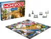 A Monopoly board game with its box and game pieces. Produktbild-Vorschau
