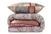 A folded duvet and a pillow are stacked on a white background. Produktbild-Vorschau
