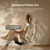 A woman is sitting in an ergonomic office chair, demonstrating its adjustable features. Produktbild-Vorschau