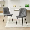 Two gray velvet dining chairs are shown in a kitchen setting. Voir les images du produit