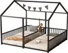 A black metal house-shaped bunk bed with two mattresses, a stuffed monkey hanging from the top, and a banner with letters spelling 'STARS' across the top. Podgląd zdjęcia produktu