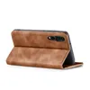 A brown flip case for a smartphone is shown standing upright on a white background. Produktbild-Vorschau