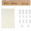 A product shot of a pleated blind and its accessories, with packaging in the background. Produktbild-Vorschau
