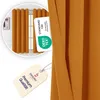 A close-up of a curtain with a tag and a certification label. Produktbild-Vorschau