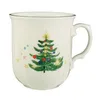 A white mug with a Christmas tree design and stars. Produktbild-Vorschau