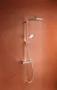 A modern shower system with a square overhead shower and a handheld showerhead, mounted on a wall with water flowing from the overhead shower. Anteprima dell’immagine prodotto