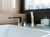 A modern bathroom sink with a chrome faucet and shower head. Náhled obrázku produktu