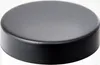 A close-up shot of a black, round lid or cap. Produktbild-Vorschau