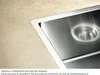 A close-up of a stainless steel sink integrated into a beige countertop. Produktbild-Vorschau