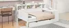 A white daybed with drawers and a bookshelf headboard is shown in a room with a desk and chair. Produktbild-Vorschau