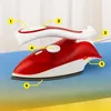 A red and white travel iron is shown on a blue ironing board. Produktbild-Vorschau
