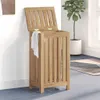 A wooden laundry hamper with its lid open, placed in a room with a plant and a rug. Náhľad obrázku produktu