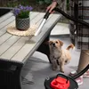 A person is vacuuming a table with a dog watching. Anteprima dell’immagine prodotto