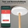 A smartphone displaying an app interface next to a smoke detector mounted on a ceiling. Produktbild-Vorschau