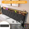 A close-up view of a bed's headboard with integrated LED lighting and charging ports. Produktbild-Vorschau