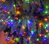 A close-up view of a decorated Christmas tree with colorful lights. Produktbild-Vorschau