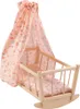 A doll's cradle with a floral canopy and bedding. Produktbild-Vorschau