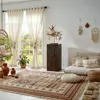 A cozy living room with a bohemian-inspired decor, featuring a wooden column as a decorative piece. Anteprima dell’immagine prodotto