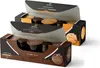 Two open boxes of Tchibo Cafissimo coffee capsules, stacked on top of each other, with some capsules visible. Produktbild-Vorschau