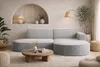A modern living room with a light gray sectional sofa, a round wooden coffee table, and decorative elements. Produktbild-Vorschau
