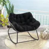 A rocking chair on a balcony overlooking the ocean. Produktbild-Vorschau