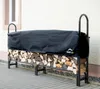 A black tarp covers a metal firewood rack filled with chopped wood, placed on a paved patio next to a building. Náhľad obrázku produktu