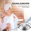 A woman relaxing in a sauna, with a product shown in the foreground. Produktbild-Vorschau