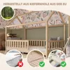 A children's house bed made of natural wood, with decorative fabric panels. Produktbild-Vorschau