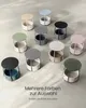 A collection of round side tables in various colors, arranged on a textured floor. Produktbild-Vorschau