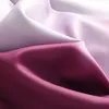Close-up of draped fabric with a color gradient. Produktbild-Vorschau
