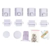 A collection of white cabinet locks and screws arranged on a white background. Voir les images du produit