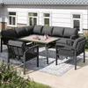 An outdoor patio setting with a sectional sofa, two armchairs, and a coffee table on a rug. Produktbild-Vorschau