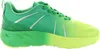 A side view of a green and yellow sneaker against a white background. Produktbild-Vorschau