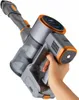 A hand holding a cordless vacuum cleaner. Produktbild-Vorschau