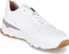 A white leather sneaker with a brown sole and gray accents is shown from the side. Produktbild-Vorschau