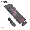 A smartphone is shown with a lavalier microphone plugged into its Type-C port. Another lavalier microphone is clipped to the side. Anteprima dell’immagine prodotto