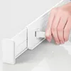 A hand is shown adjusting a white plastic divider in what appears to be a drawer or storage unit. Produktbild-Vorschau